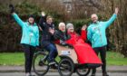 Seaton Grove residents David Hamilton and Neil Smith enjoy their bike ride piloted by Seaton activities co-ordinator Linda Garden and Cycling Without Age staff Gillian Millar (left) and Ray Burr. Image: Mhairi Edwards/DC Thomson