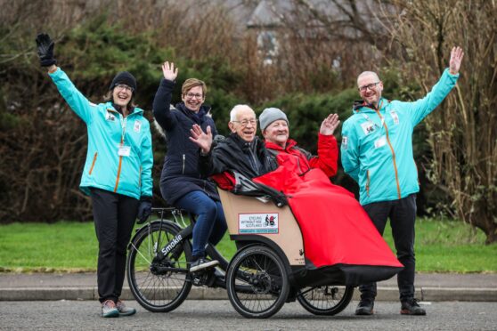 Seaton Grove residents David Hamilton and Neil Smith enjoy their bike ride piloted by Seaton activities co-ordinator Linda Garden and Cycling Without Age staff Gillian Millar (left) and Ray Burr. Image: Mhairi Edwards/DC Thomson