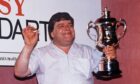 Jocky Wilson celebrates with a cheeky cigarette following his 1989 win.