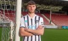New Dunfermline Athletic FC signing Brad Holmes stands with his arms folded at East End Park.