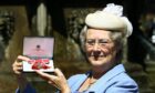 Eileen Rumble received her MBE from the Queen at Holyrood House in 2014.