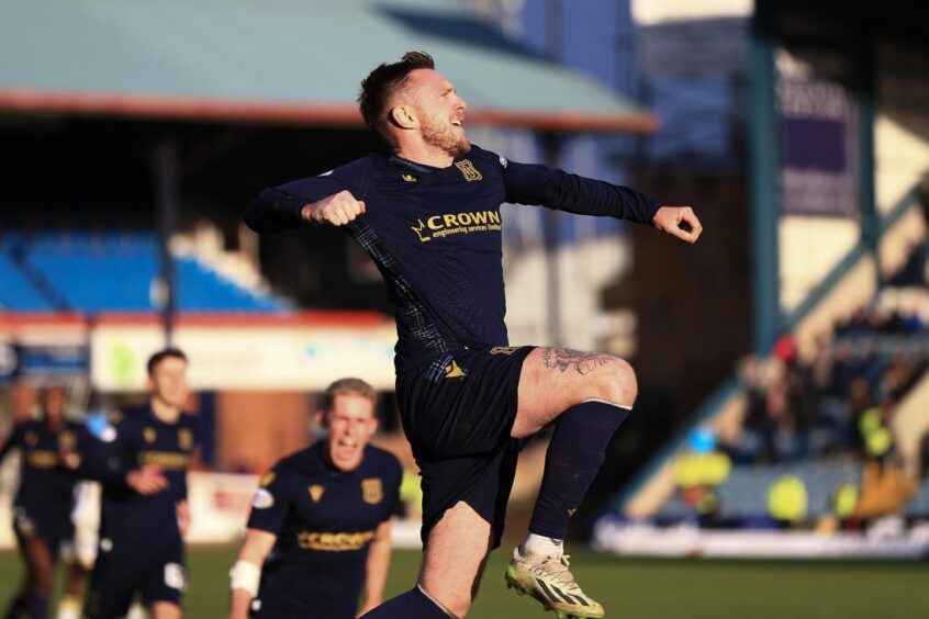 Dundee's Jordan McGhee celebrates his winner against St Johnstone.