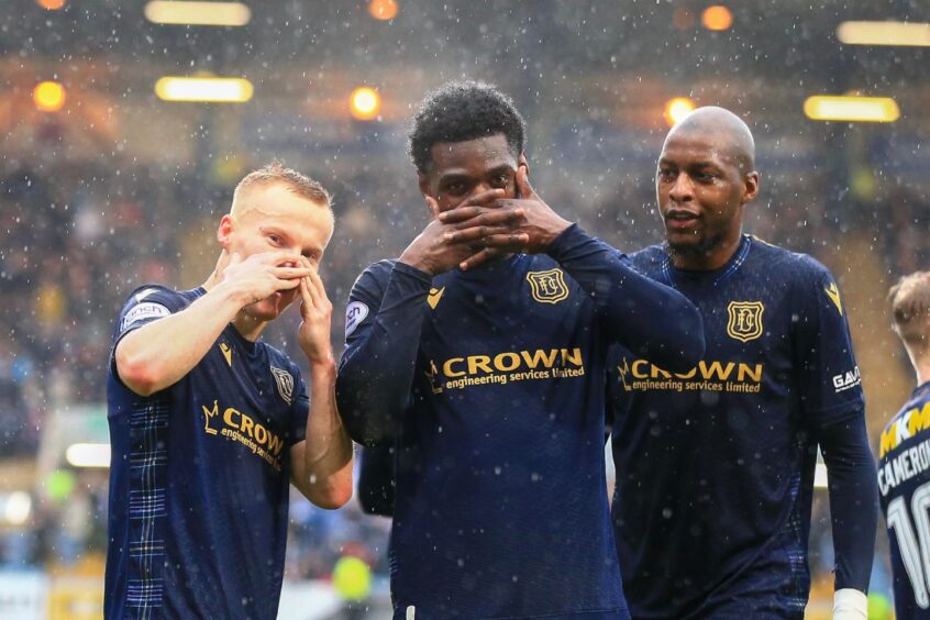 Scott Tiffoney, Amadou Bakayoko and Mo Sylla celebrate as Dundee defeated Ross County. Image: Shutterstock/David Young