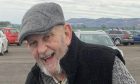 Keith Payne in flat cap, smiling at Errol Sunday Market
