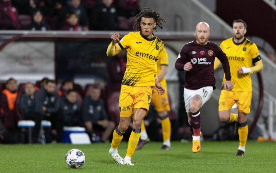Miles Welch-Hayes has his eye on the ball in a game for Livingston against Hearts.