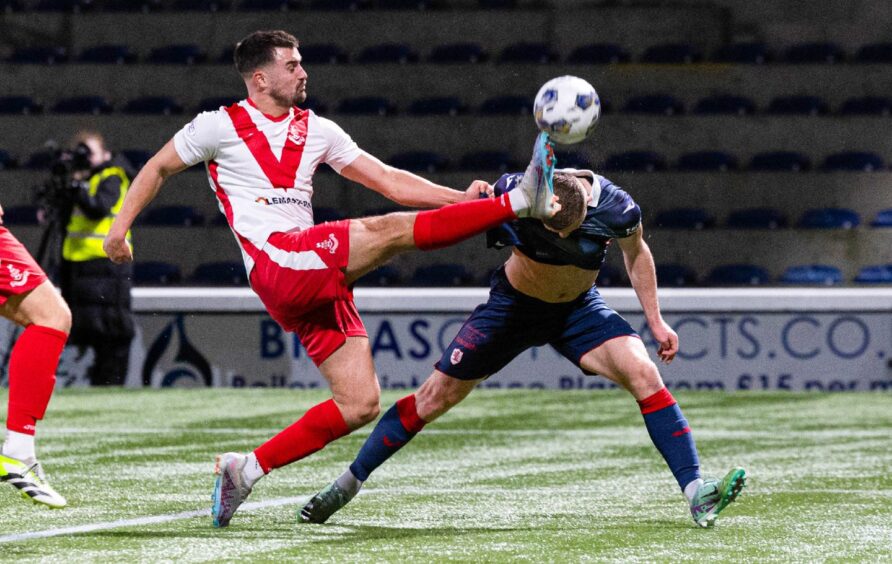 Raith Rovers striker Callum Smith stoops bravely to head the ball against Airdrie.