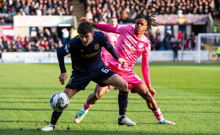 Owen Beck in action for Dundee against Hearts. Image: SNS