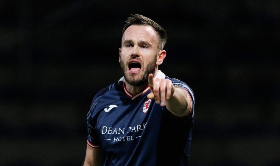 Keith Watson points and shouts instructions to his Raith Rovers team-mates.