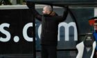 Dunfermline manager James McPake throws his hands in the air in exasperation.