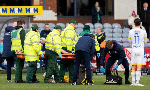 Michael Mellon was stretchered off late in the game against St Johnstone. Image: SNS