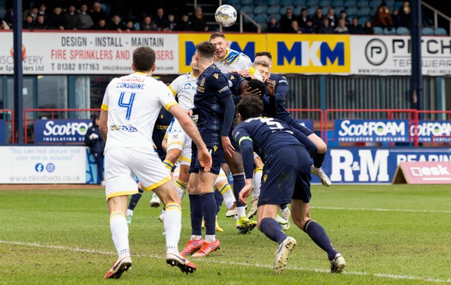 Dundee were awarded a penalty after VAR spotted a Liam Gordon foul on Amadou Bakayoko. Image: SNS