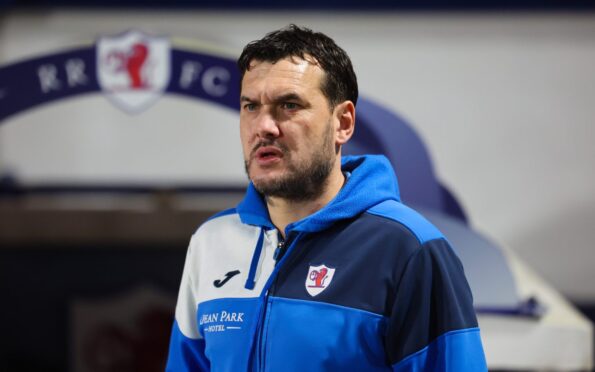 Raith Rovers manager Ian Murray looks into the distance in front of the Stark's Park dugout.