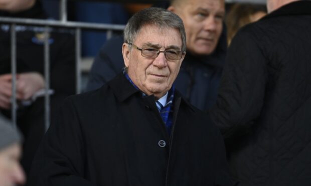 Geoff Brown in stand at football match