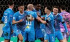 The Dunfermline Athletic F.C. players congratulate Malachi Fagan-Walcott following his equaliser against Partick Thistle.