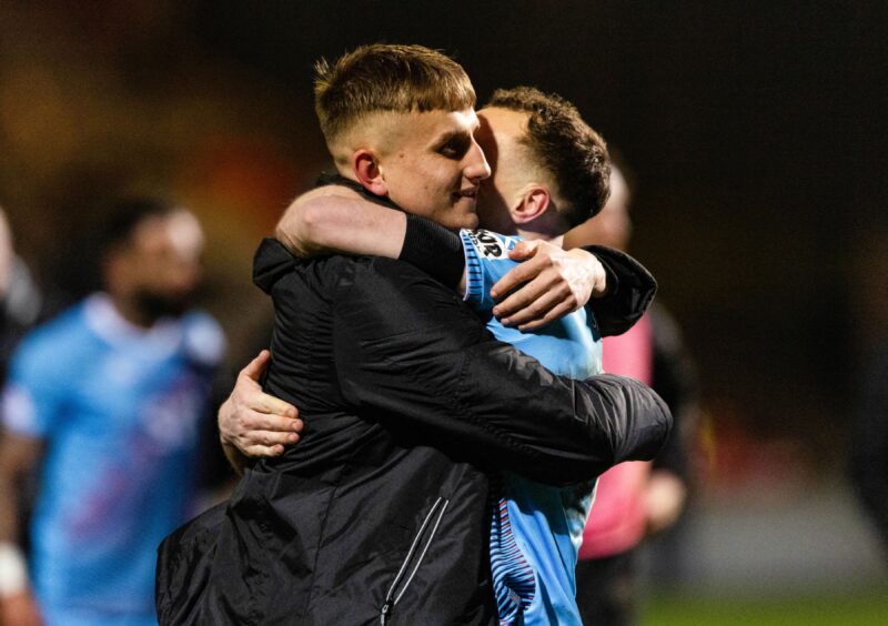 Matty Todd and Chris Hamilton hug at full-time following Dunfermline Athletic F.C.'s victory over Partick Thistle.
