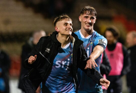 Matty Todd (left) and Lewis McCann celebrate at full-time after Dunfermline Athletic F.C. win 3-1 against Partick Thistle.