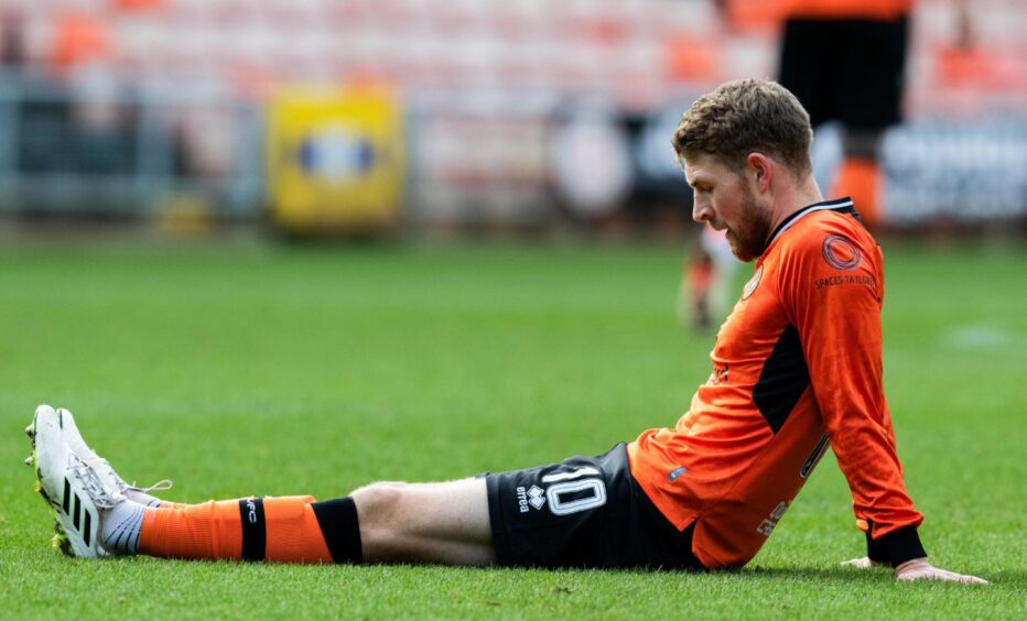 Dundee United's David Wotherspoon awaits treatment
