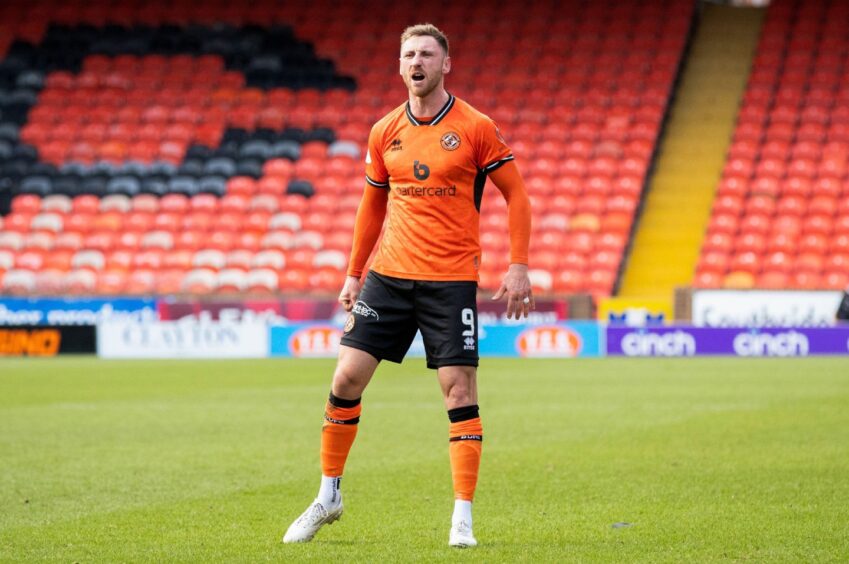 Louis Moult celebrates his stunning free-kick for Dundee United