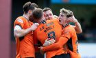 Dundee United players celebrate going 2-1 up against Queen's Park