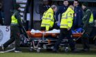 Adama Sidibeh was stretchered off the pitch in Paisley after his collapse. Image: Rob Casey/SNS