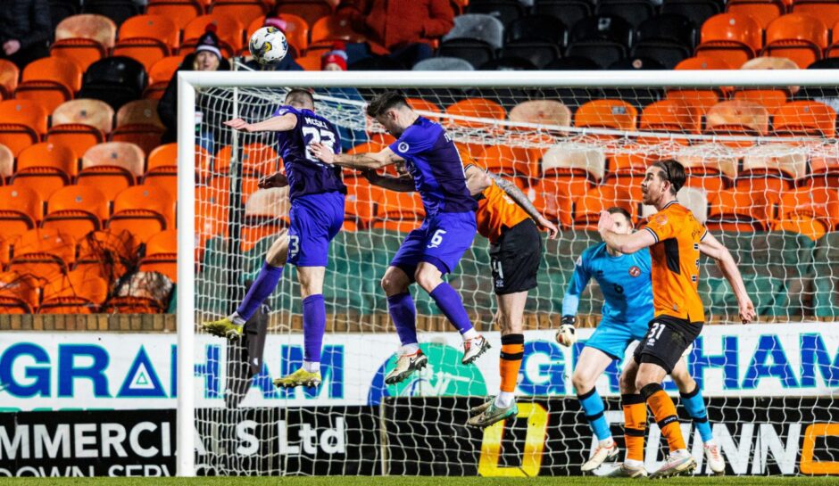Gabby McGill gives Airdrie the lead versus Dundee United with a header in a crowded box
