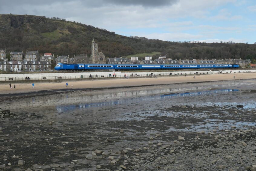 Grant Brown's photo of the Blue Pullman at Burntisland shows the train reflected in the water