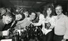 Linda Lusardi with The Stables general manager Ian Manson and pub regulars in 1987.