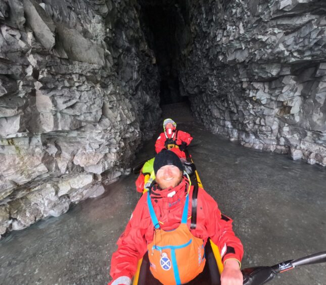 Exploring a sea cave on the journey through the Northwest Passage.