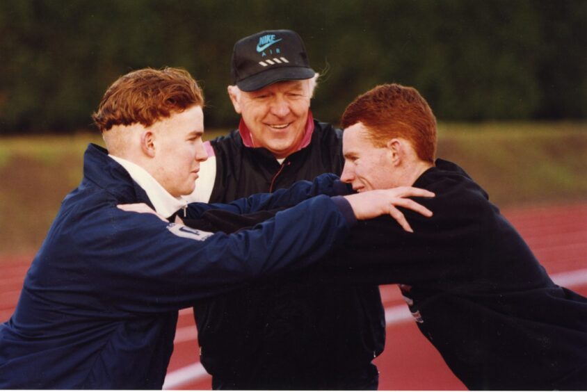 Anderson coaching Jonathan Goldie and Ian Campbell at Caird Park in 1994.