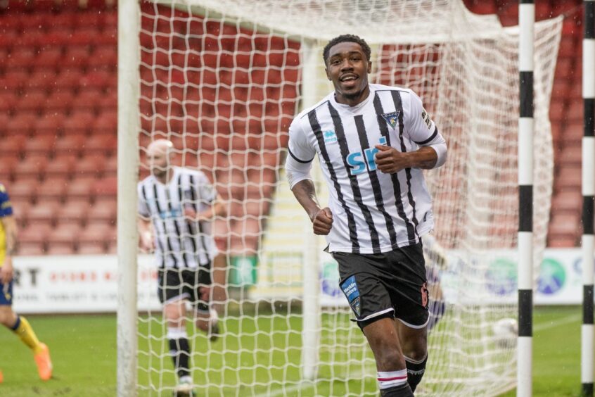 Dunfermline Athletic defender Malachi Fagan-Walcott is full of smiles as he wheels away after scoring his first senior goal.