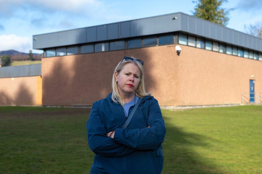 Fiona Rollo, arms folded, outside Pitlochry High School