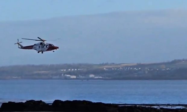 Coastguard helicopter off the Fife coast near Culross