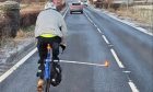 Cyclist with 'bizarre' bike extension on the A85 in Perthshire.