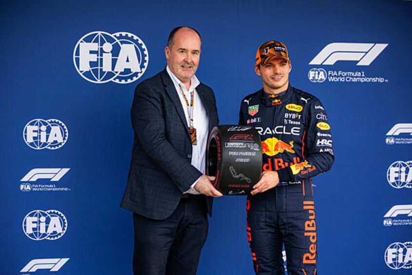 FIA Vice President Robert Reid meeting Max Verstappen.