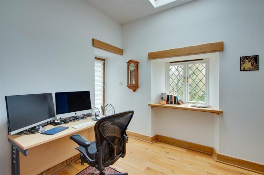 One of the bedrooms is currently used as an office. Image: Savills 