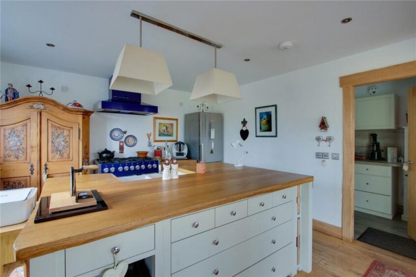 A small utility room sits off the kitchen. Image: Savills 