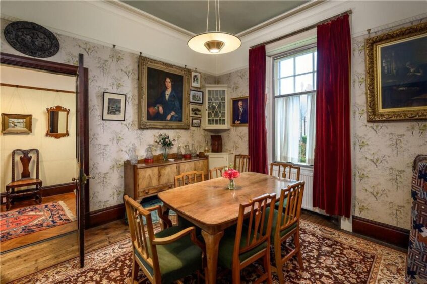 The dining room sits off the hall.