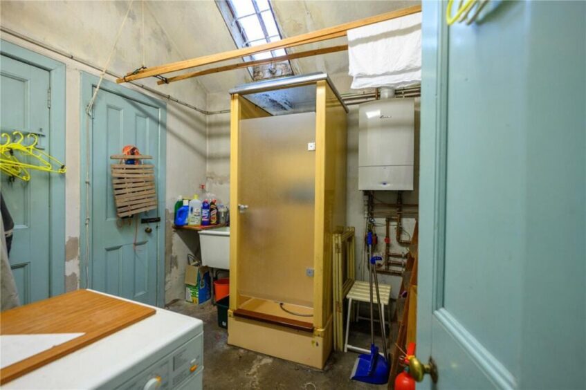 Tucked away at the back is a utility room with shower.