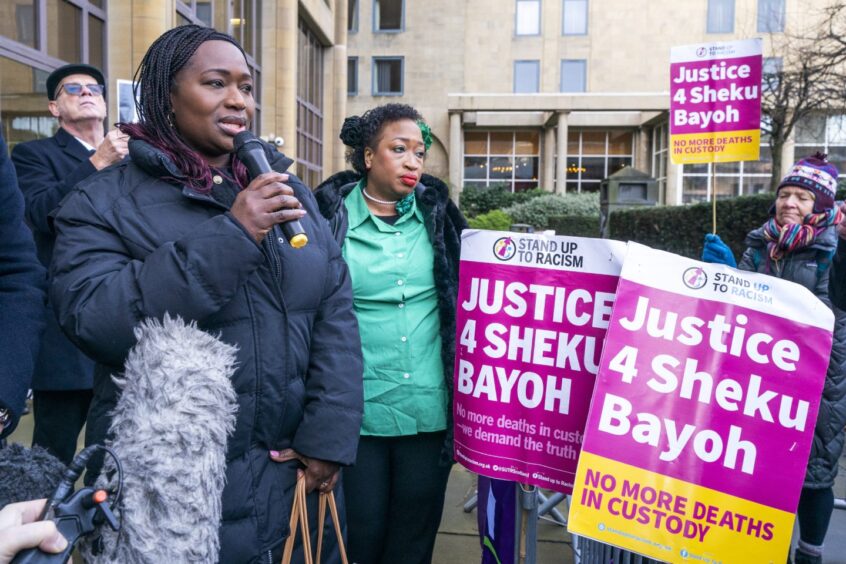 Sisters of Sheku Bayoh, Kadi Johnson (left) and Kosna Bayoh (centre) outside Capital House, Edinburgh, before the hearings restarted