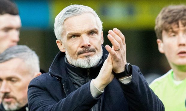 Jim Goodwin salutes the Dundee United fans