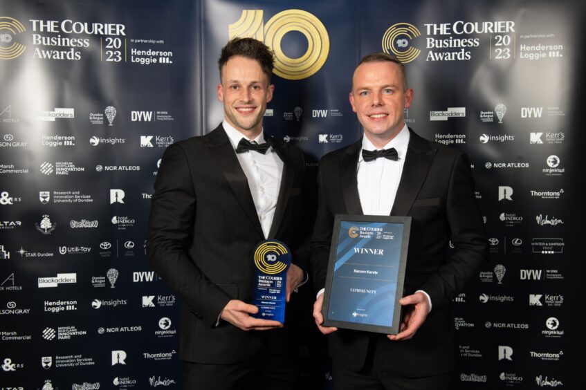Dan Woods and Roy O'Kane with their award following the presentation at the Courier Business awards held at the Apex Hotel Dundee.