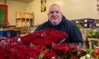 Scott McKimmie with some of the valentines flower stock in the warehouse. Image: Kim Cessford / DC Thomson