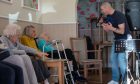 Paul Cooney entertaining residents with songs from the sixties at Orchar Nursing Home in Broughty Ferry. Image: Kim Cessford/DC Thomson
