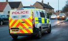 Police outside Dundee home on Balunie Avenue after woman's death