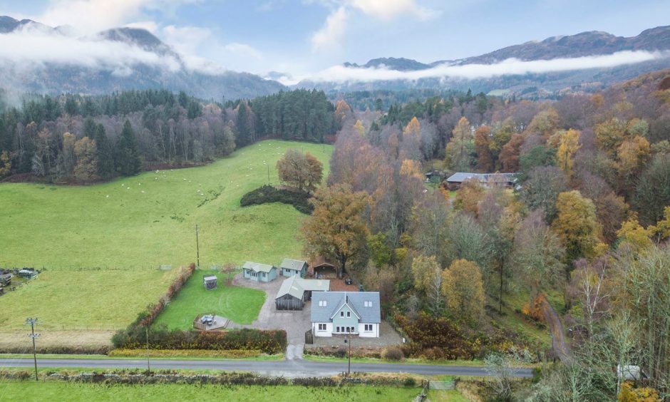 An aerial shot showing Kerryfearn and the distant Perthshire mountains