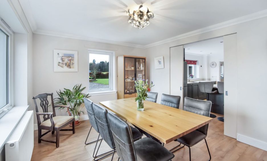 The dining room is semi-open plan to the living room.