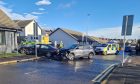 One car crashed into a garden after the two-car smash on Ann Street in Dundee. Image: Andrew Robson/DC Thomson