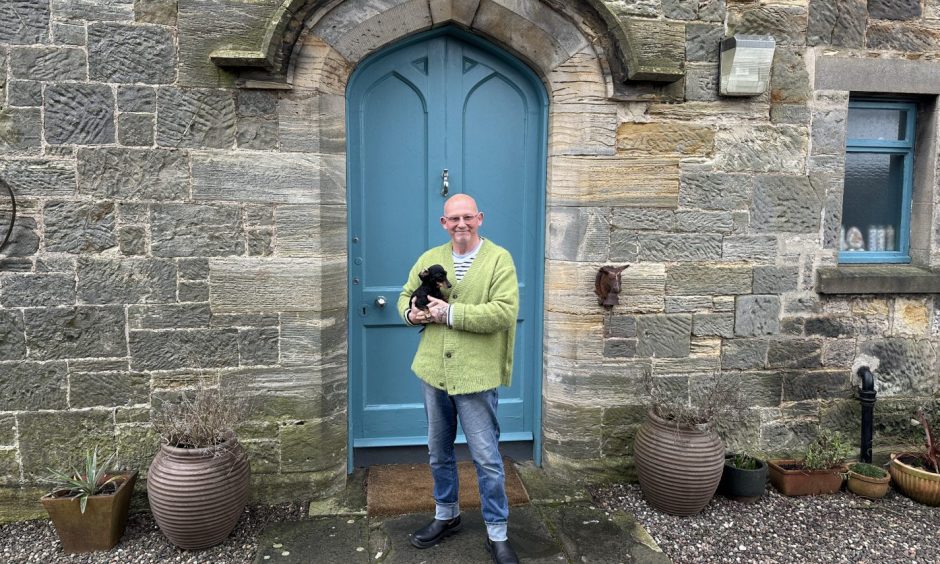 Alan Wyllie with his dog Boo outside their Milton of Balgonie church conversion.