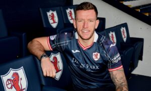 Lee Ashcroft sits in the directors' box at Stark's Park in a Raith Rovers strip.