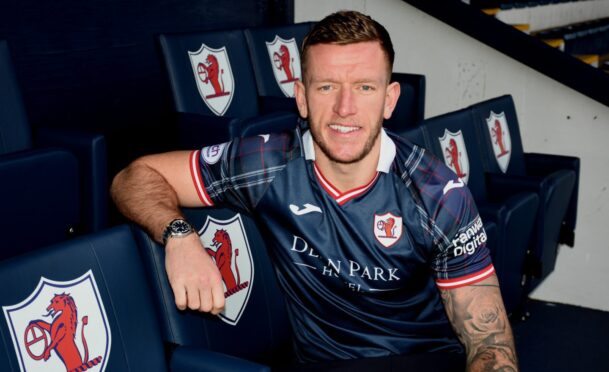 Lee Ashcroft sits in the directors' box at Stark's Park in a Raith Rovers strip.